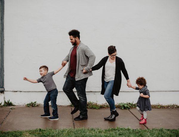 Family of four walking at the street