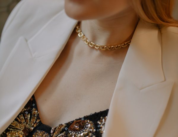 Photo of a woman wearing gold chain necklace