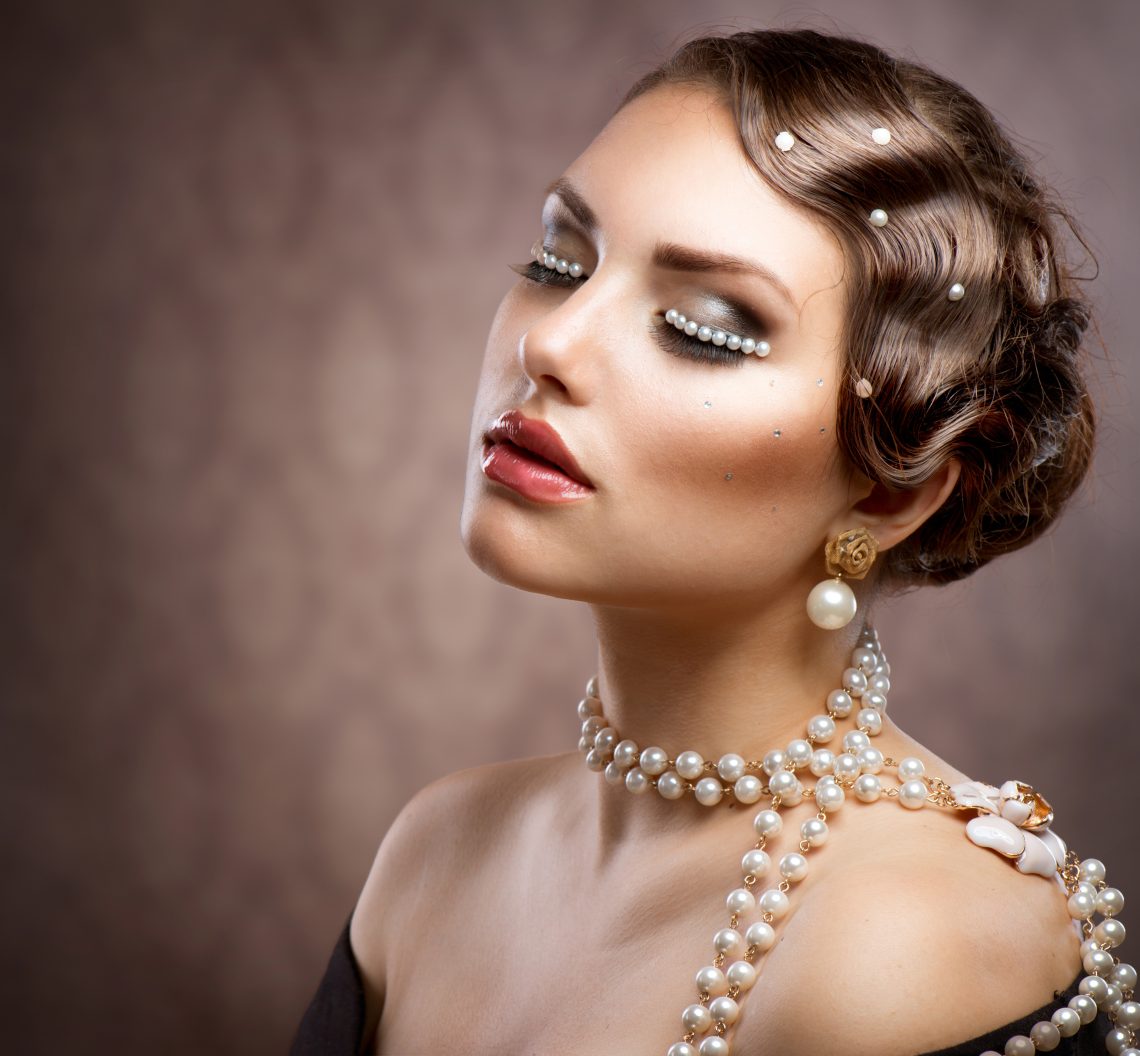 Retro Styled Makeup With Pearls. Beautiful Young Woman Portrait
