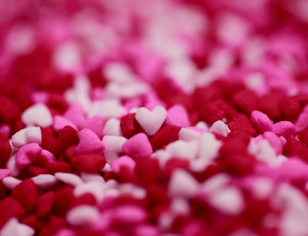 Close up shot of tiny heart shaped sugar candy sprinkles.