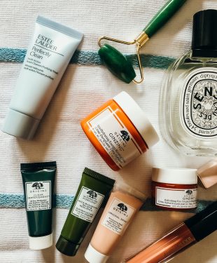 Bunch of skin care products and Diptyque fragrance