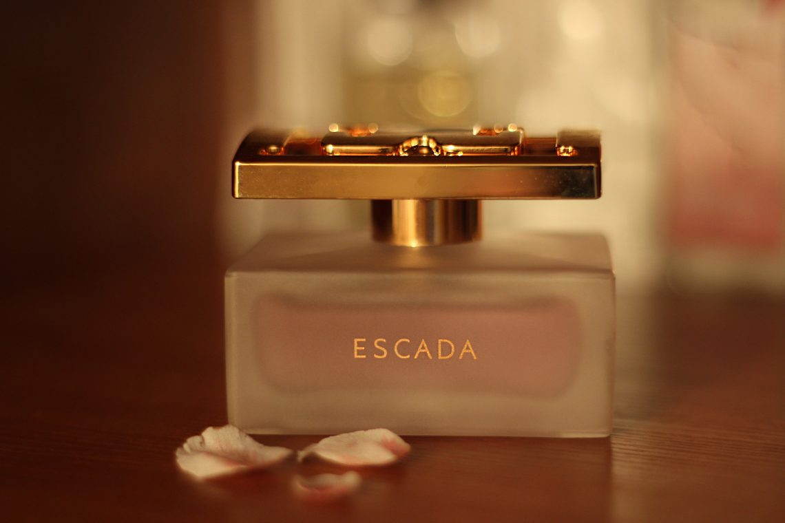 Escada perfume bottle on table