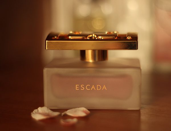 Escada perfume bottle on table