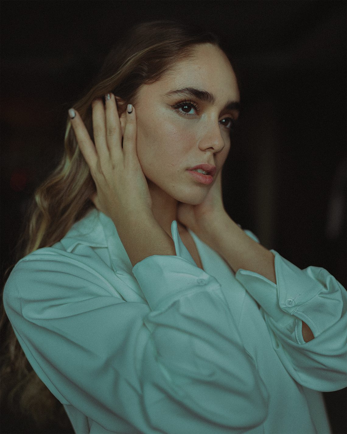 Woman in teal button up shirt