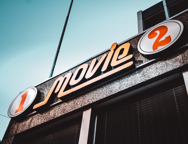 1 movie 2 signage under white clouds