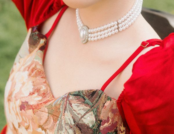 A woman wearing beautiful pearl necklace