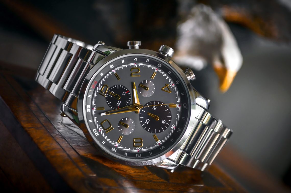 Silver linked bracelet silver and black round chronograph watch