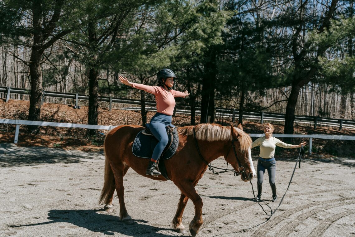 Woman riding horse in park