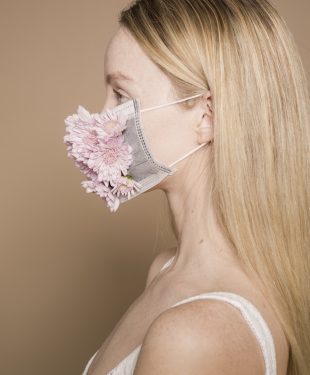 Woman in flower facial mask