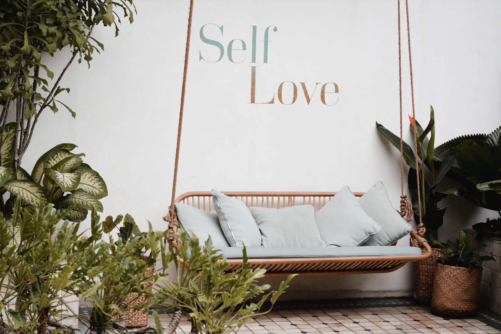 A swing in front of a spa in Bali.