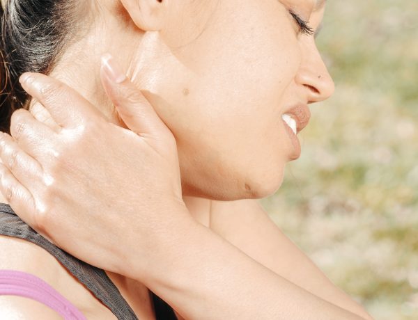 Close up photo of woman having a neck pain