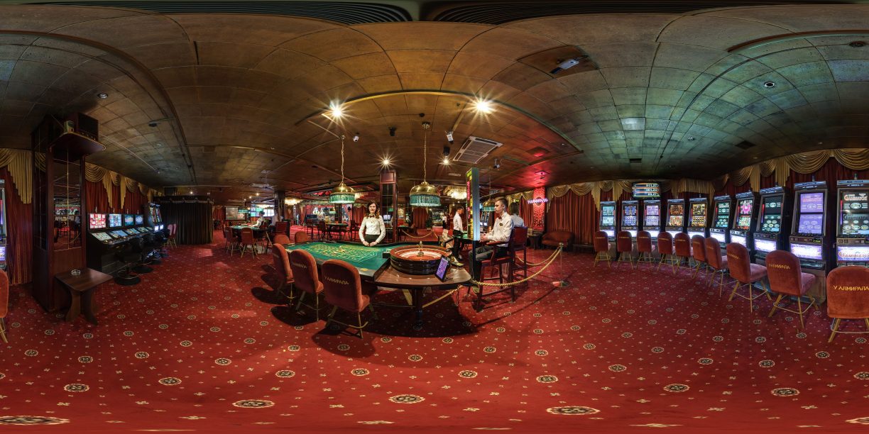 MINSK, BELARUS - FEBRUARY, 2017: full seamless panorama 360 degrees angle view in interior elite luxury casino with croupiers girls in red style in equirectangular spherical projection. VR content