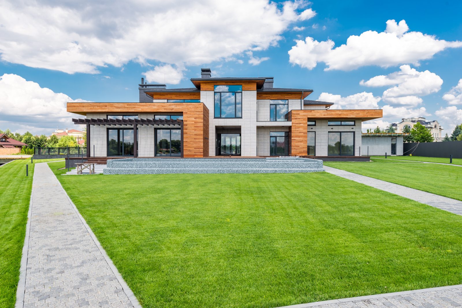 Exterior of modern house with glass doors and panoramic windows