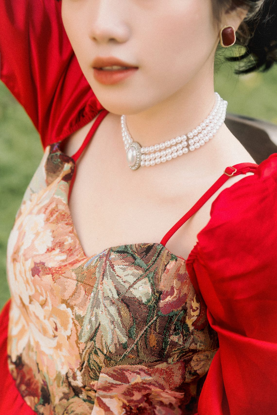 A woman wearing beautiful pearl necklace