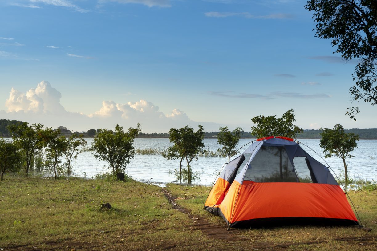 Camping dome tent near a body of water