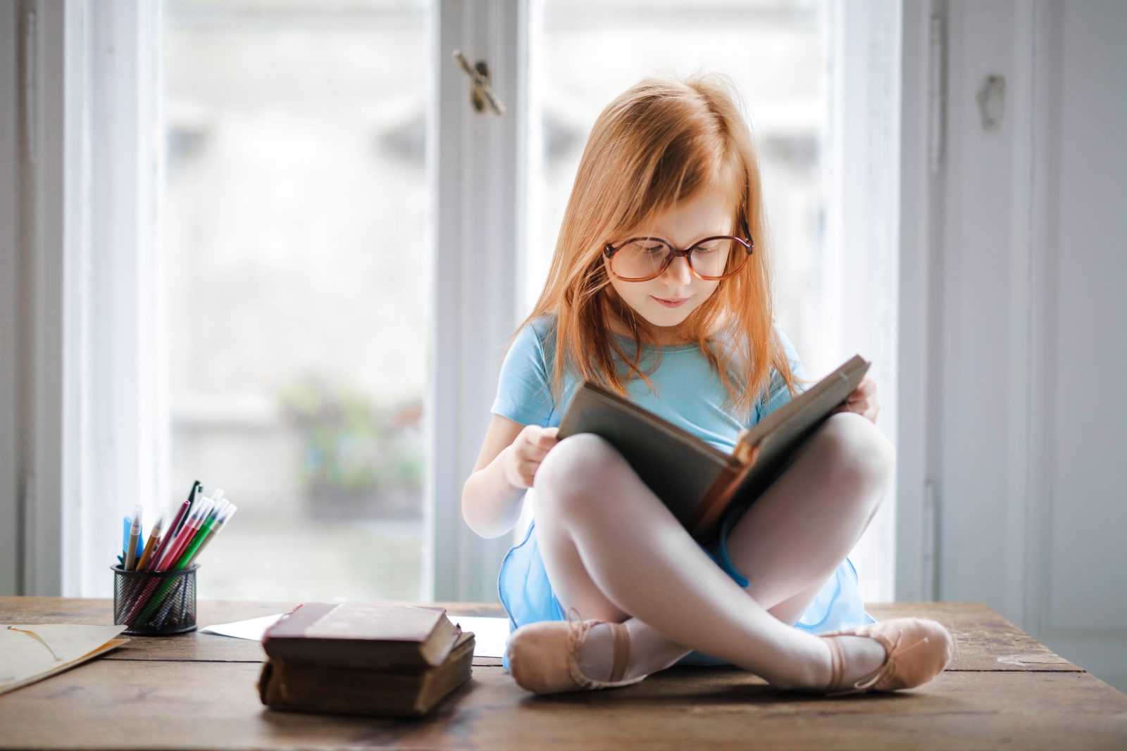 Photo of girl reading book