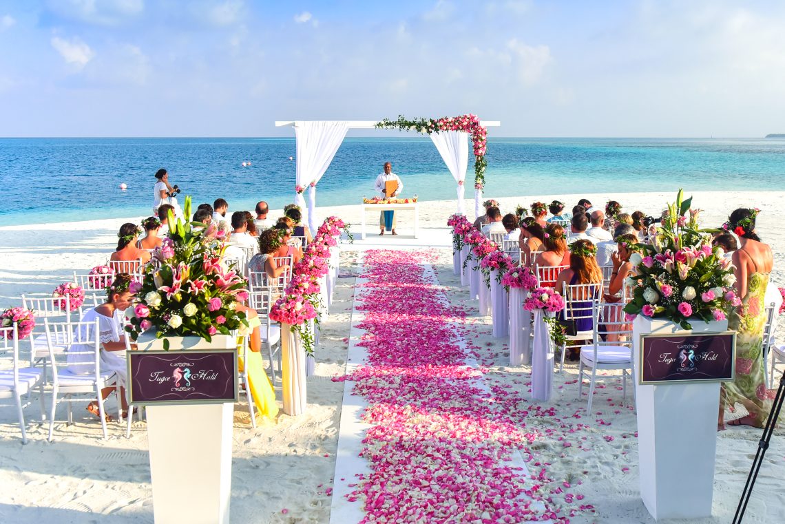 Beach wedding ceremony during daytime