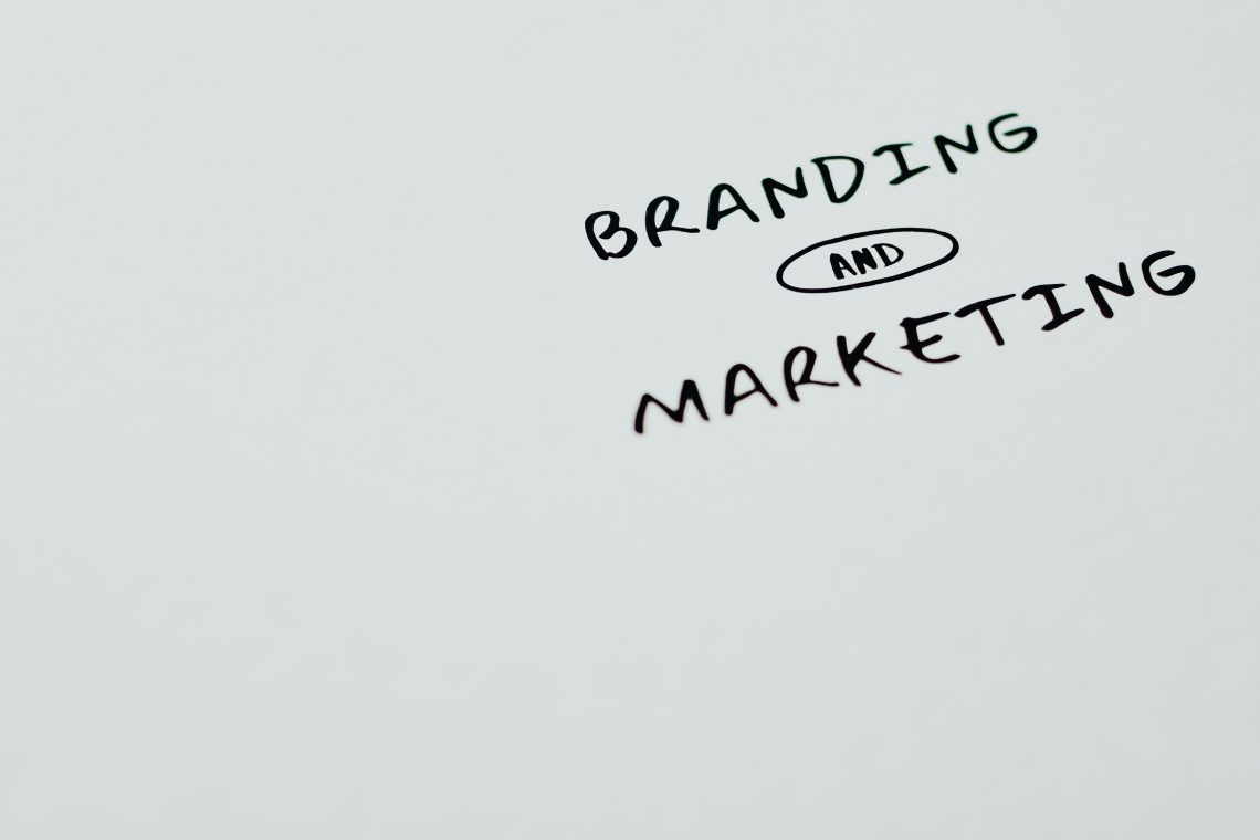 Branding and marketing text on a white surface