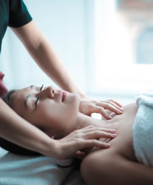 Selective focus photo of woman getting a massage