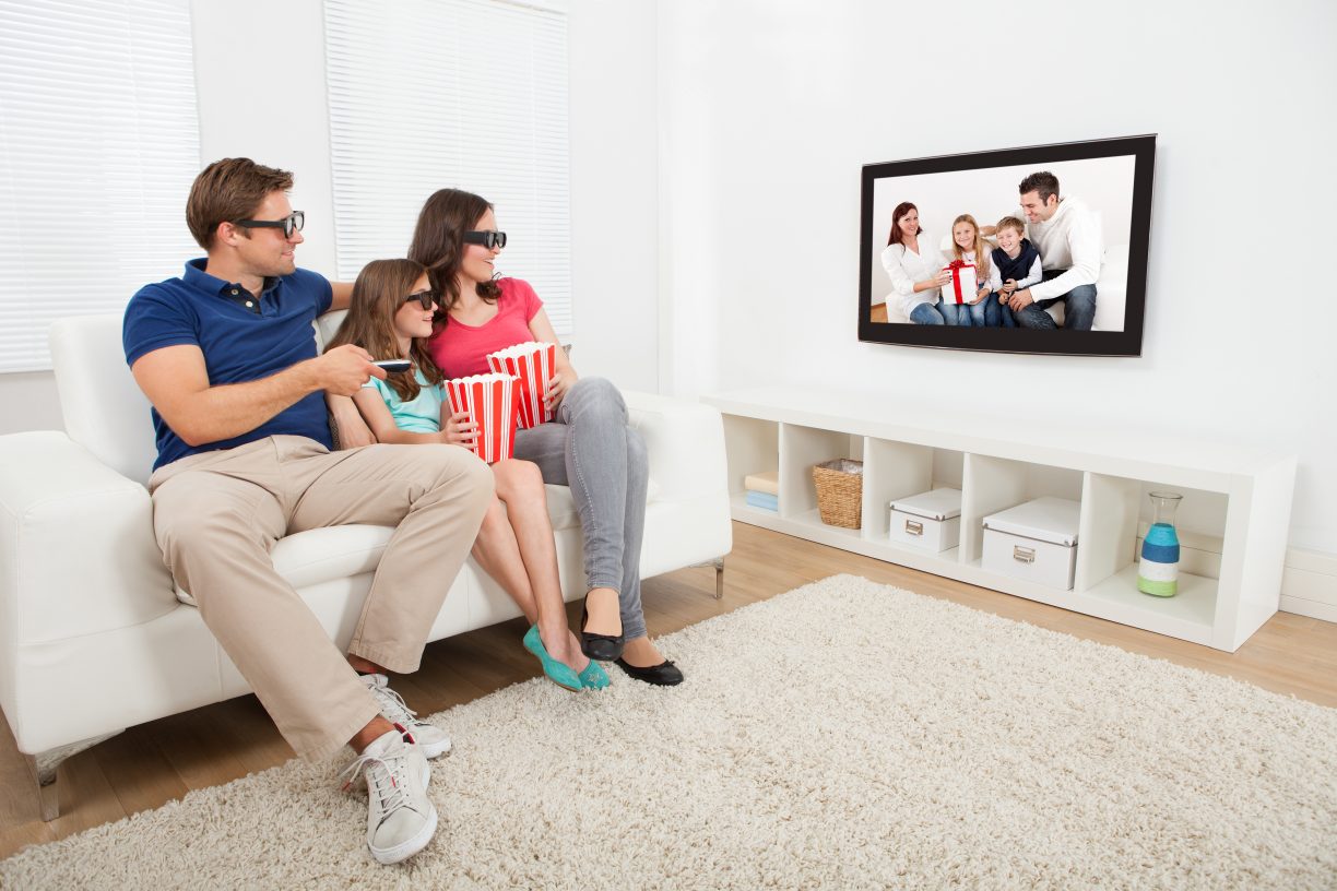 Family Watching 3D Movie On Television