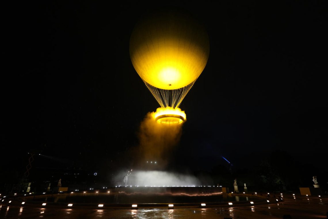 Celine Dion delivers powerful performance as Olympic cauldron floats into the night sky