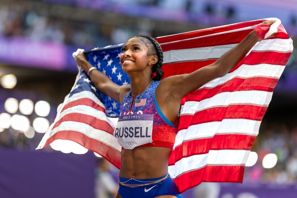 Olympic Gold Medalist Masai Russell Learned How To Manage Her NIL Deals From Her Mother