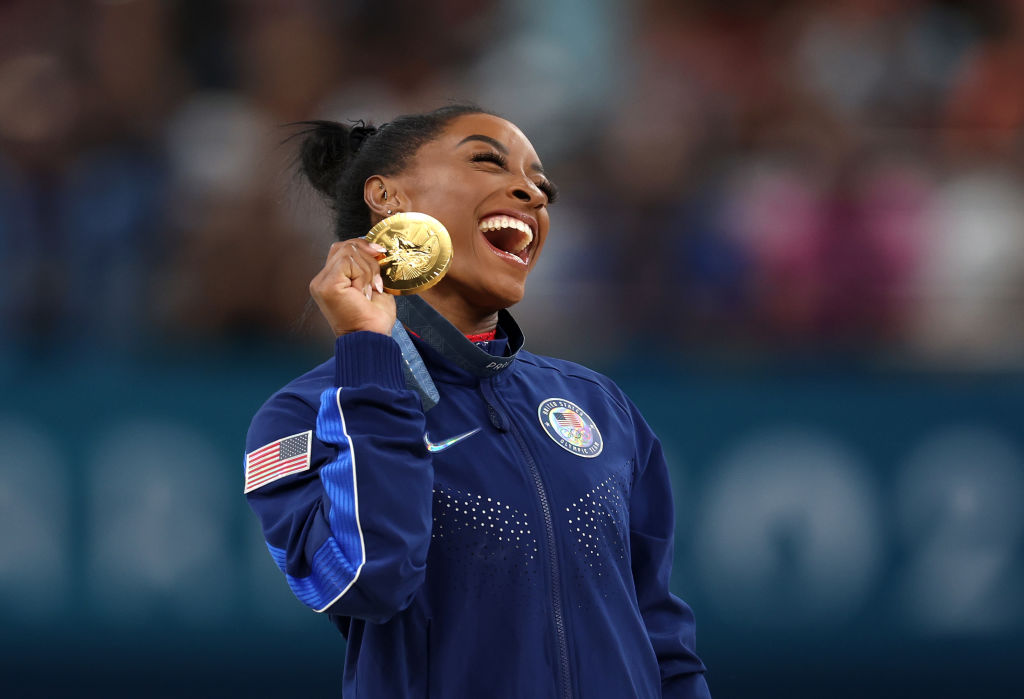 Simone Biles Adds Restaurateur To Her Resume As She’s Set To Bring A ‘Taste Of Gold’ To Her Hometown Airport